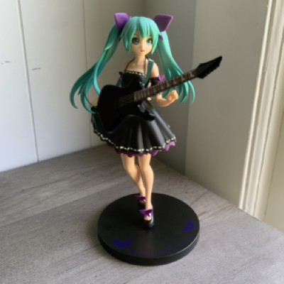anime figure holding 3D model guitar